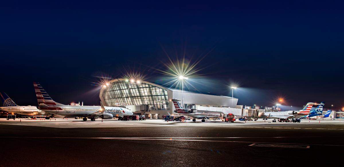 Airliners are parked outside the Fresno Yosemite International Airport concourse. More than 2.1 million passengers flew aboard departing and arriving flights at the airport in 2022, more than any previous year.