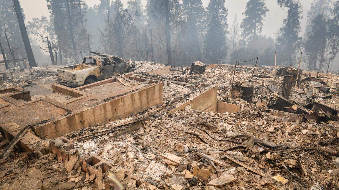 Several destroyed homes and a vehicle are seen in Big Creek on Monday, Sept. 7, 2020 after the Creek Fire burned through the area over the weekend. Although several homes were destroyed, the general store, the school and several other buildings appear undamaged.