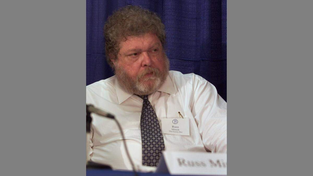 Russ Minick, deputy editorial page editor for The Fresno Bee, moderates the “Making California Work” editorial board meeting in June 2005.