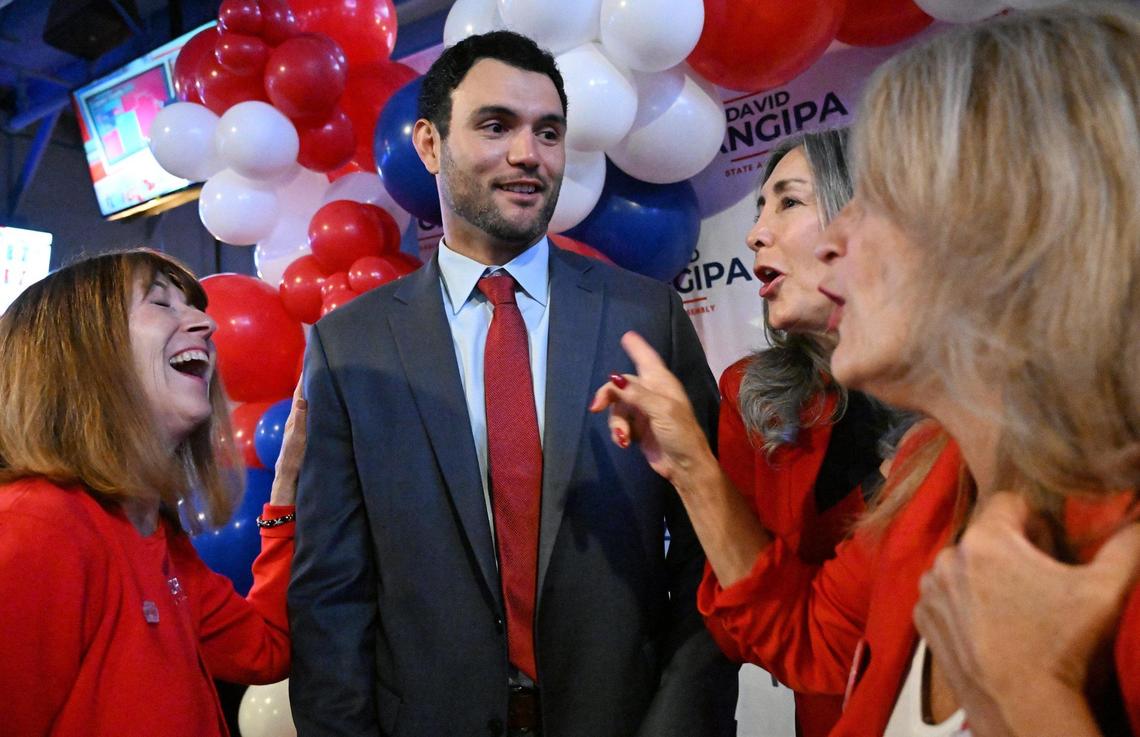 California Assembly District 8 candidate David Tangipa, second from left, is talks to supporters at Field House Tuesday night, Nov. 5, 2024 in Fresno.