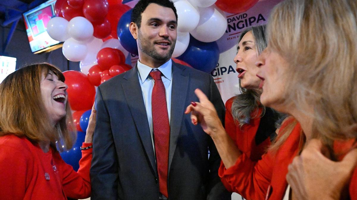 California Assembly District 8 candidate David Tangipa, second from left, is talks to supporters at Field House Tuesday night, Nov. 5, 2024 in Fresno.