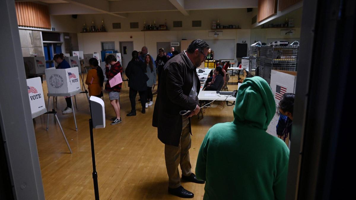 Voters arrive at a voting center on the Buchanan High campus in northeast Fresno, where power was knocked out several hours before polls were to close on Election Night, Tuesday, Nov. 8, 2022.