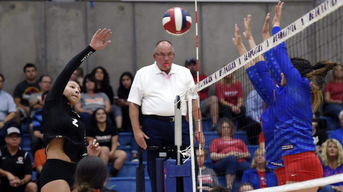 In a FILE photo, Central’s Makayla Lewis, left, slams the ball against Buchanan in a Tri-River Athletic Conference showdown at Buchanan High Tuesday, October 3, 2017 in Clovis, CA. Central won 3-2.