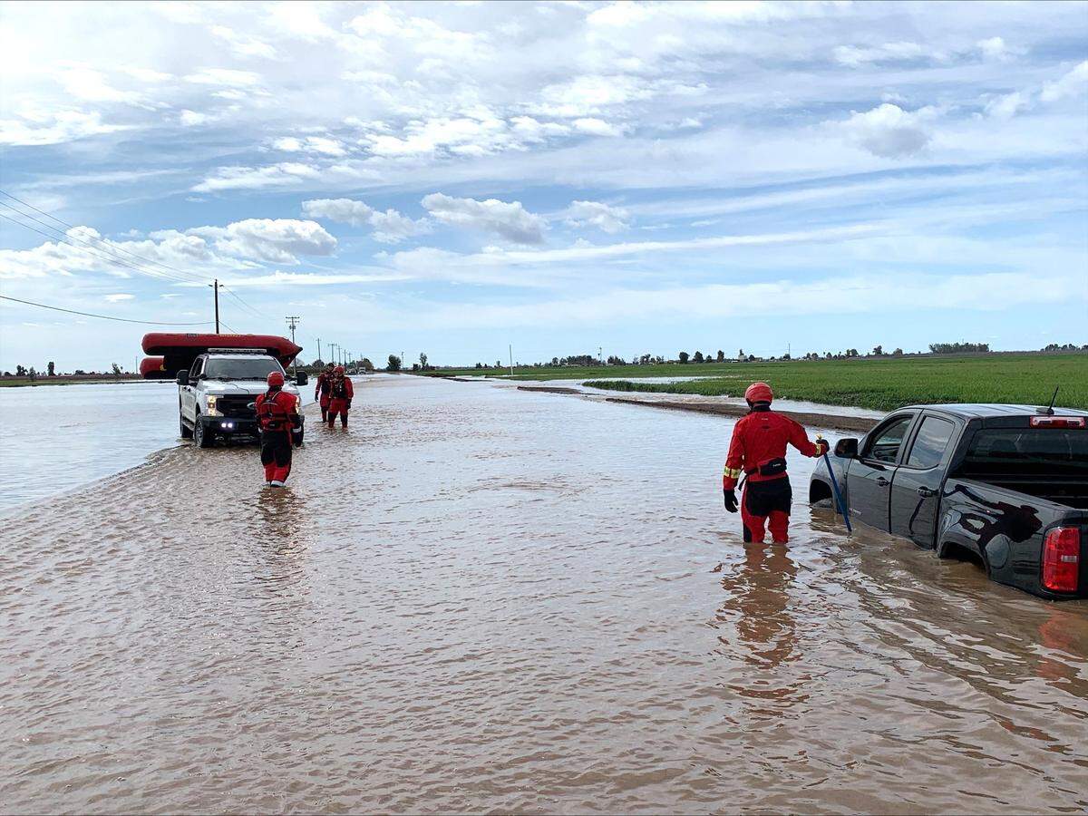 A swift-water team from the Tulare County Sheriff’s Department rescued a man whose pickup was swept into a water-filled culvert after he tried to cross a flooded roadway on Sunday, March 12, 2023.