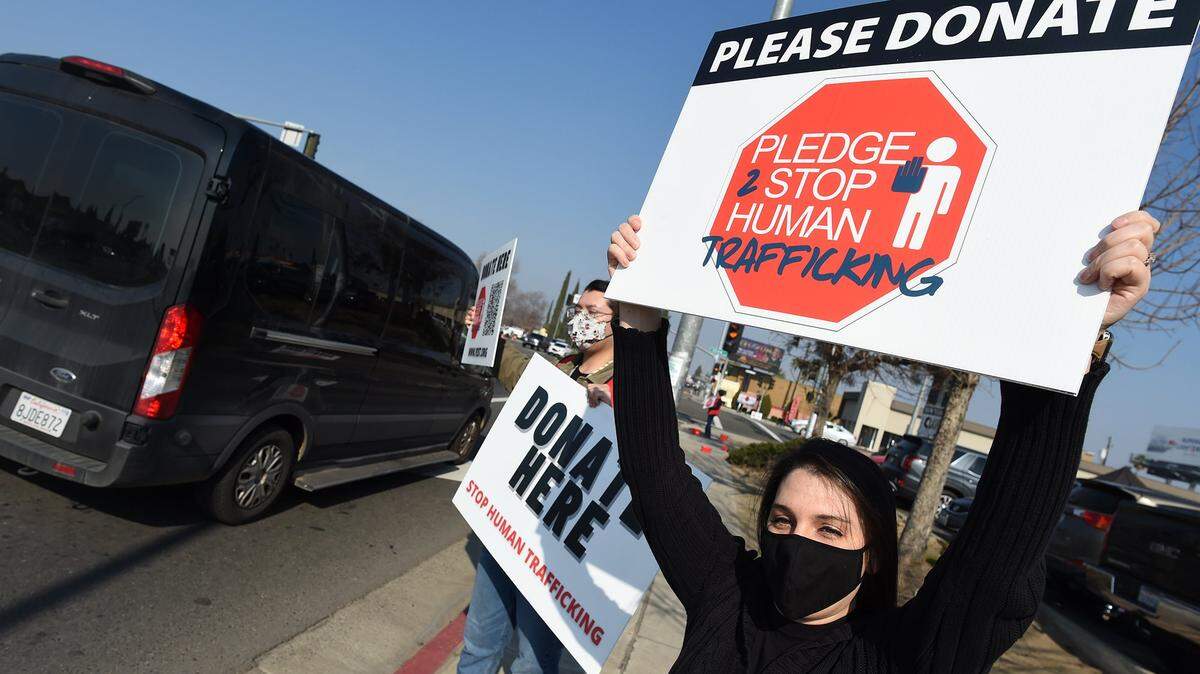 Sandy Quinn joins a rally to kick off the 5th Annual Pledge to Stop Trafficking event (PTST), Tuesday, Jan 18, 2022, at Blackstone and Shaw in Fresno.