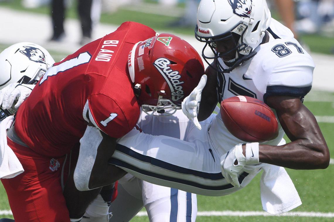 Fresno State cornerback DaRon Bland hits UConn wide receiver Cameron Hairston Saturday, Aug. 28, 2021, in Fresno. The Bulldogs led 31-0 at halftime.