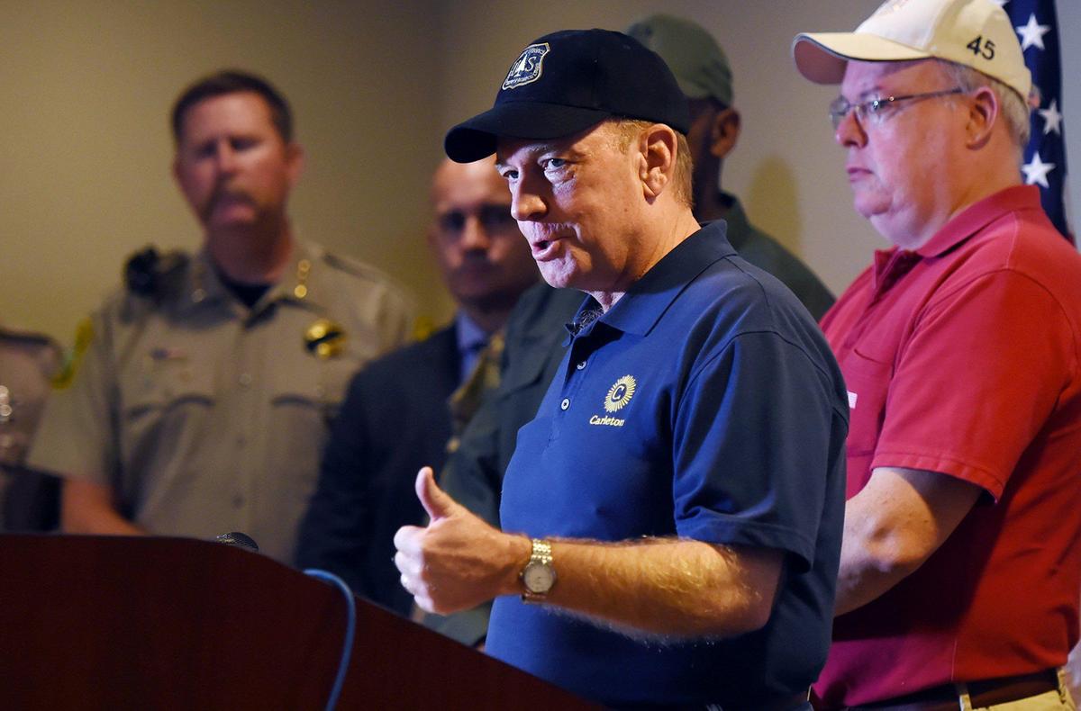 U.S. Attorney McGregor Scott, center, describes illegal marijuana groves he viewed in the Sierra National Forest in Madera Countyduring a press conference announcing the formation of efforts to combat illegal marijuana grows on public land Tuesday, Aug. 20, 2019 in Fresno.