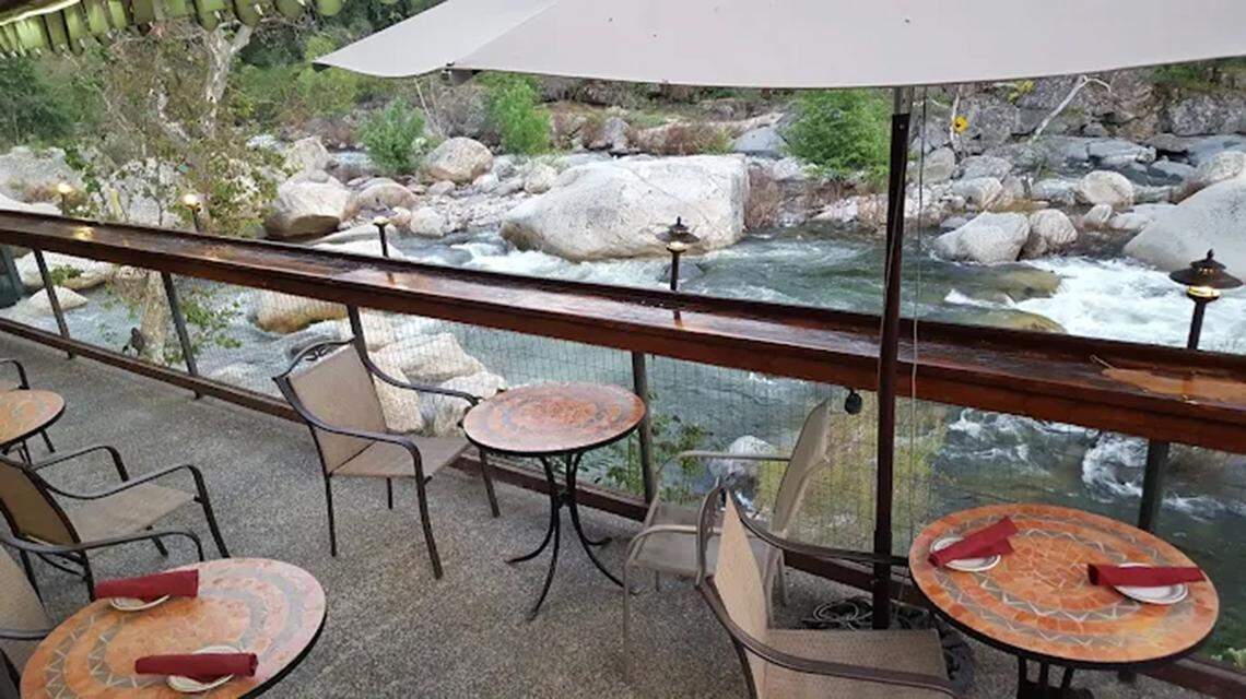 The deck at The Gateway Restaurant & Lodge is directly on the Kaweah River. Diners have views of the hills, occasional wildlife and the historic Pumpkin Hollow Bridge.
