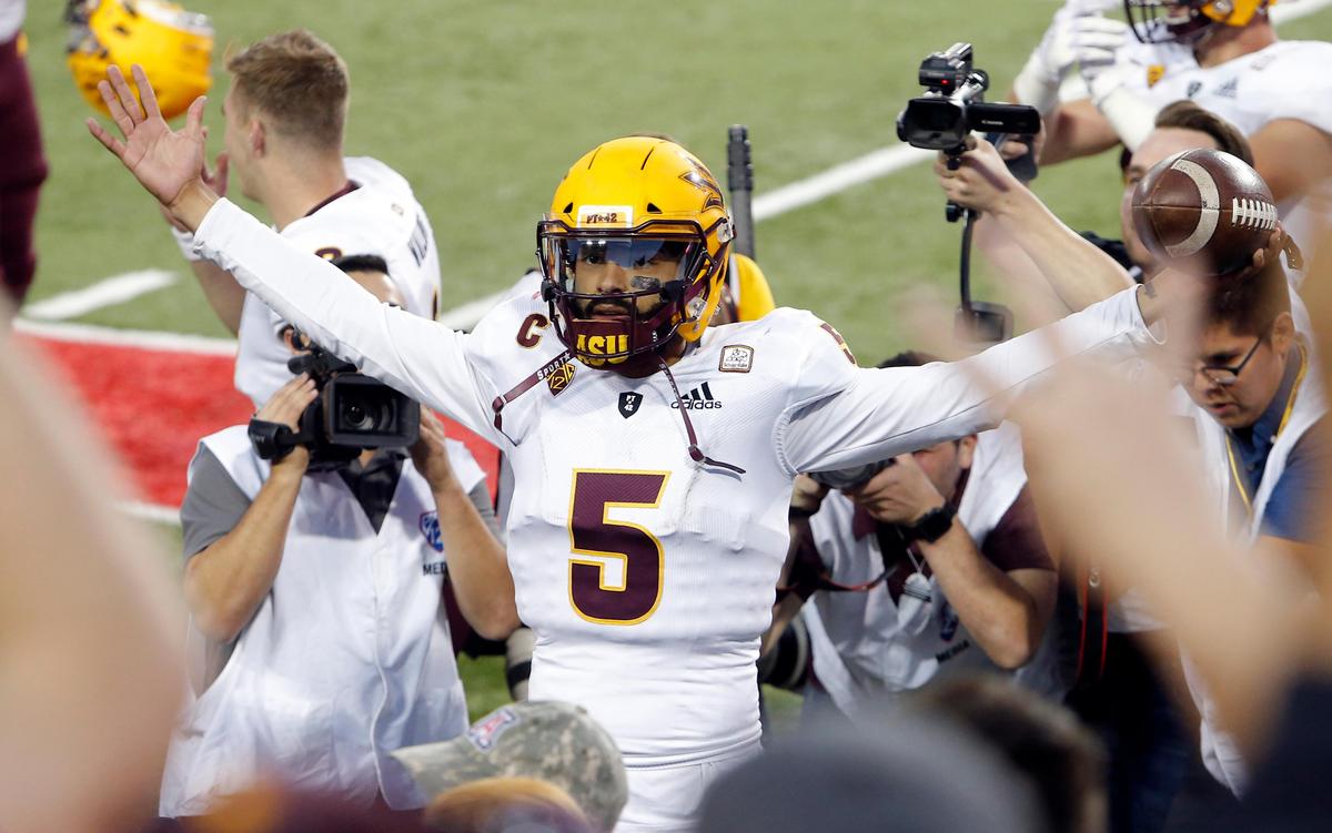 Arizona State quarterback Manny Wilkins celebrates with the fans after defeating the Arizona Wildcats 41-40. The Sun Devils play the Mountain West Conference champion Fresno State Bulldogs in the Las Vegas Bowl Saturday, Dec. 15, 2018, at Sam Boyd Stadium in Las Vegas.