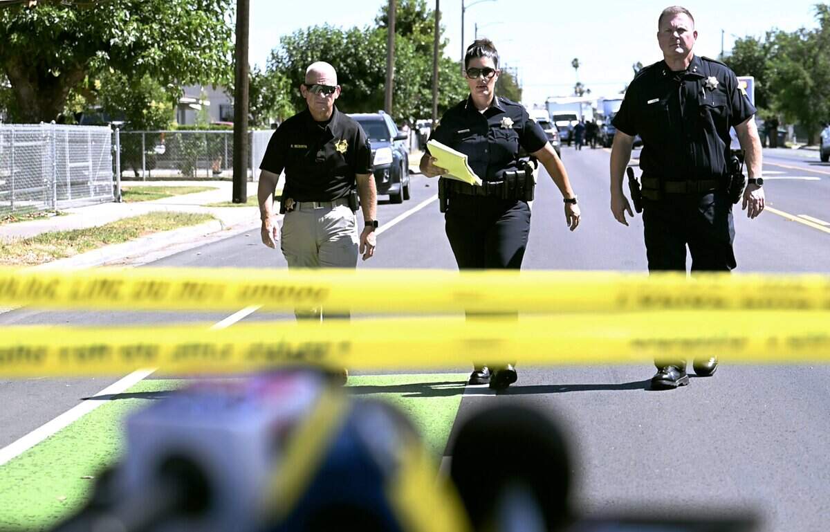 Fresno Chief of Police Mindy Casto, center, walks towards the media to offer an update of an officer involved shooting on Cedar Avenue south of Church Avenue Friday afternoon, June 5, 2026 in Fresno.