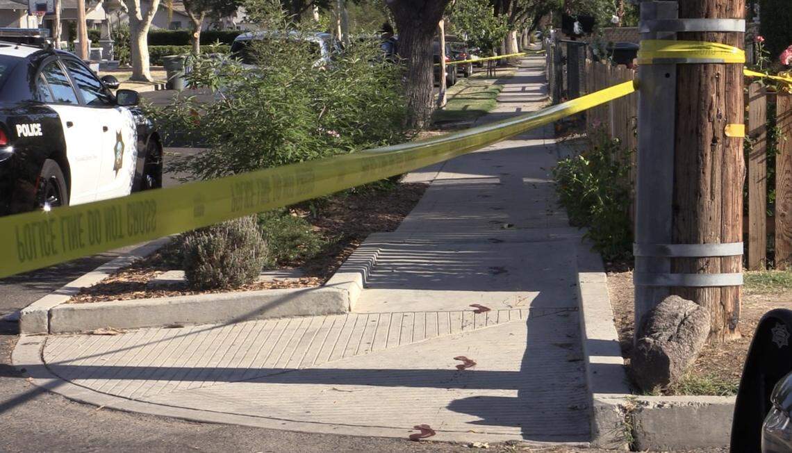 A blood trail is left on the sidewalk after a man was allegedly attacked and stabbed by two men in Fresno, California on Thursday, June 23, 2022.