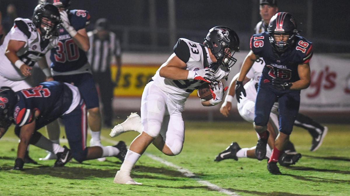 Hanford’s Trace Gonzalez rumbles into the end zone for a touchdown against Memorial in the first half of their game at San Joaquin Memorial on Friday, Aug. 27, 2021. The Bullpups will host Lemoore in the Milk Can game on Friday, Oct. 29, 2021.