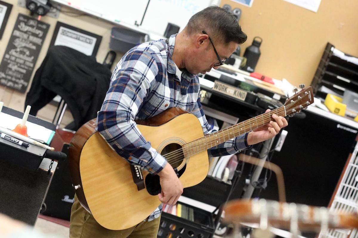 Orosi High School mariachi band director Jonathan Gaspar during the mariachi class on Wednesday, March 15, 2023.