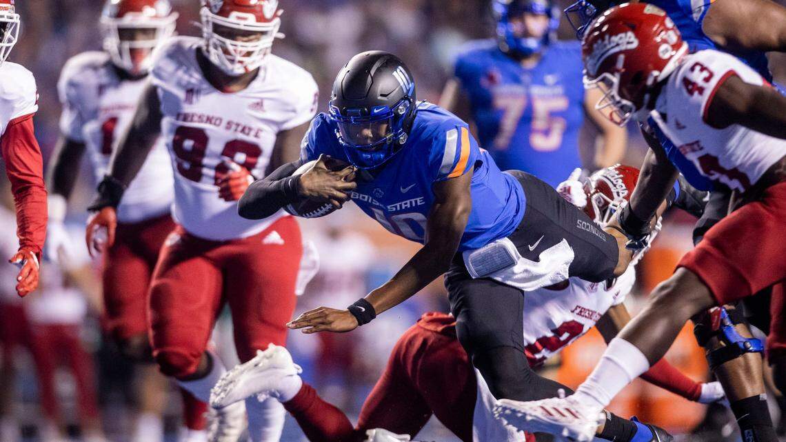 Boise State quarterback Taylen Green dives for yards in the first half against Fresno State, Saturday, Oct. 8, 2022, at Albertsons Stadium in Boise.