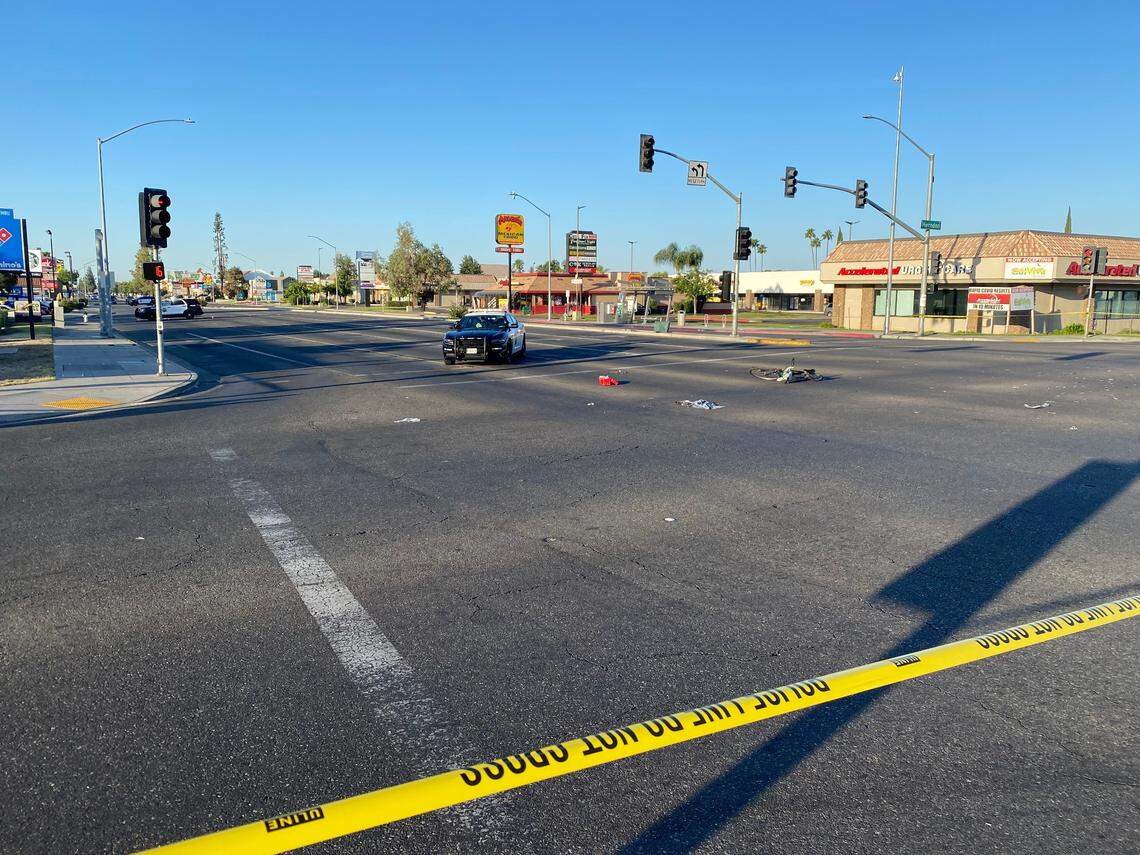Fresno Police block off a portion of the intersection at Blackstone and Herndon avenues Tuesday morning, May 24, 2022, after a fatal bicycle collision. The bike remains in the roadway.