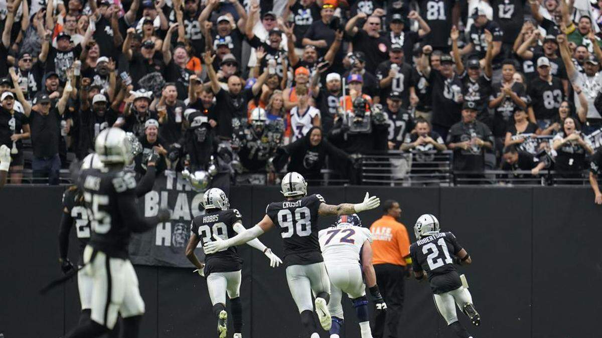 Las Vegas Raiders cornerback Amik Robertson runs back a fumble for a touchdown against the Denver Broncos during the first half of an NFL game, Sunday, Oct. 2, 2022, in Las Vegas.