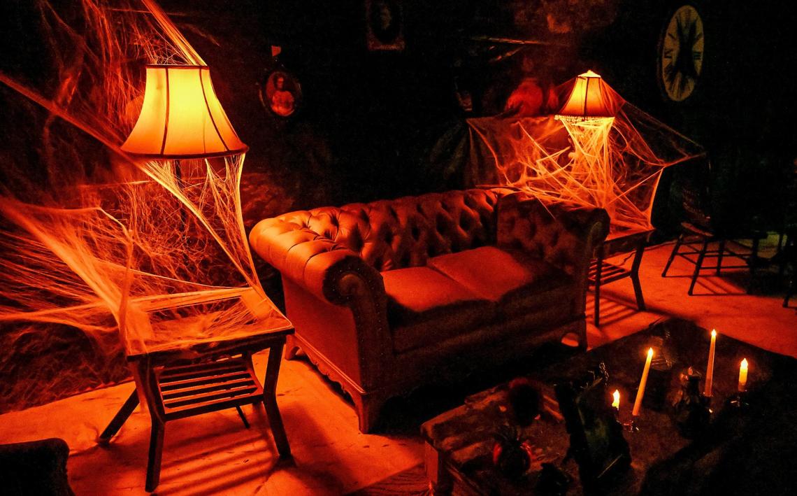 A dimly lit seance room awaits visitors in one of the three maze haunts at Scare Factory in Fresno.