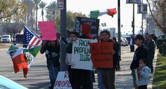 Demonstrators gather on Sunday, Jan. 12, 2025 over the raids that occurred in Kern County this week.