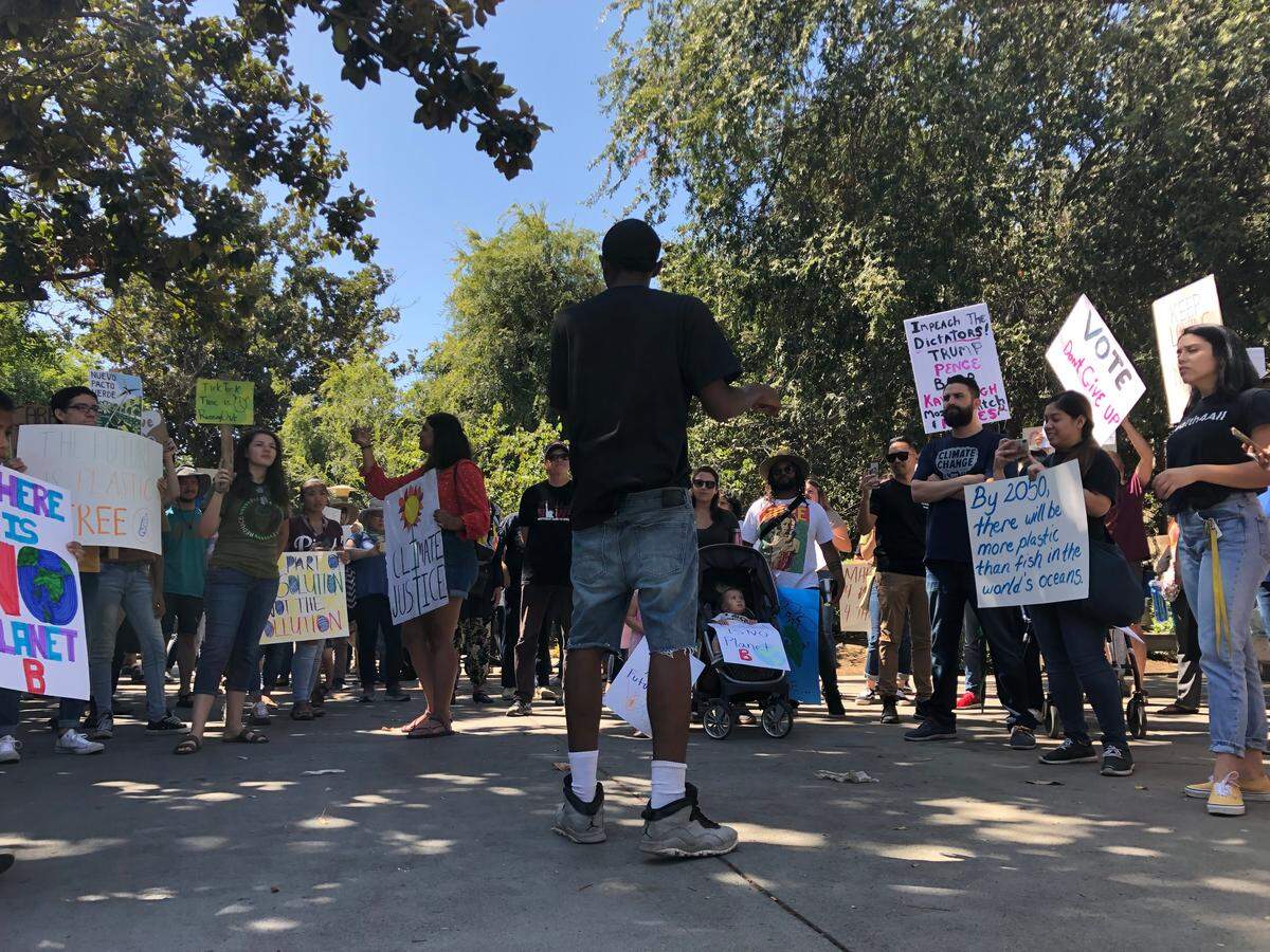Kieshaun White, 19, leads a strike through downtown Fresno calling for attention to climate change. The Fresno march was one of many held around the world on Friday, Sept. 20, 2019.