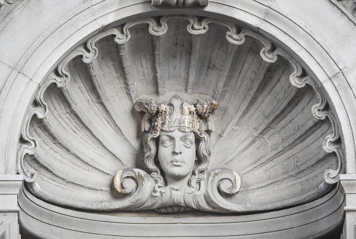 A crowned bust is set inside a scalloped shell motif on a wall of the octagonal tower of Warnors Theatre facing the intersection of Fulton and Tuolumne streets in downtown Fresno. Thursday, Nov. 11, 2021.