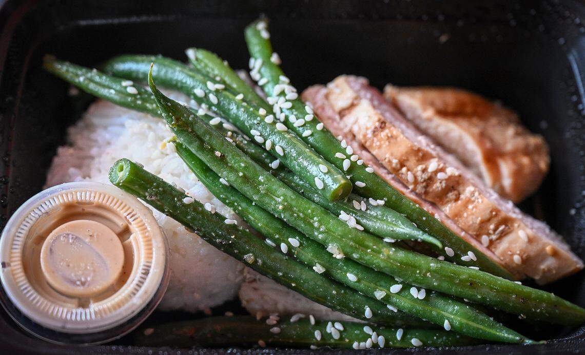 Grilled chicken, rice and veggies are among the low-calorie, high-protein healthy meal choices, prepackaged and ready for delivery or grab and go at Fire Foods meal prep in Fresno. 