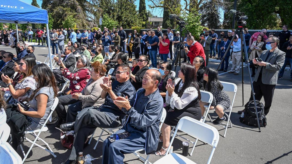 A large crowd, many of whom are members of the Hmong community, attend a dedication ceremony for the Fresno Police Department’s southeast district station, which is being named in honor of Phia Vang who died in an off-duty car crash, on Friday, April 15, 2022.