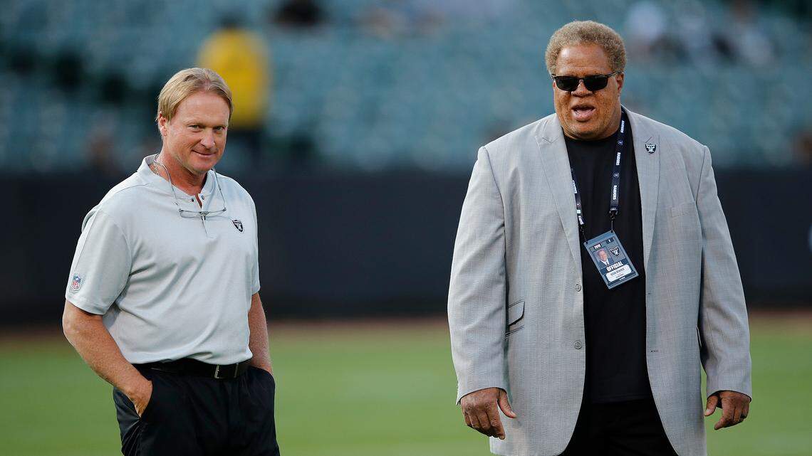 Oakland Raiders head coach Jon Gruden, left, and general manager Reggie McKenzie before an NFL preseason football game between the Raiders and the Detroit Lions in Oakland, Calif., Friday, Aug. 10, 2018.