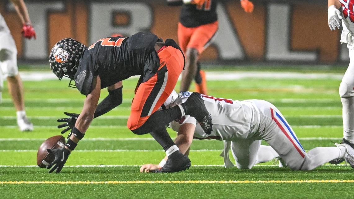 Centra’s Brandon Smith scoops up a fumble by St. Ignatius quarterback Soren Hummel before running 53 yards for a touchdown during their CIF North regional Division 1-A game at Central High on Saturday, Dec. 7, 2024.