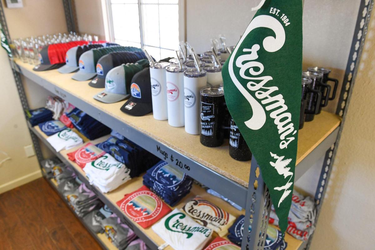 Cressman’s General Store merchandise sits on a shelf in a retrofitted storage container set up at the site of the historic store which burned down in last year’s Creek Fire.