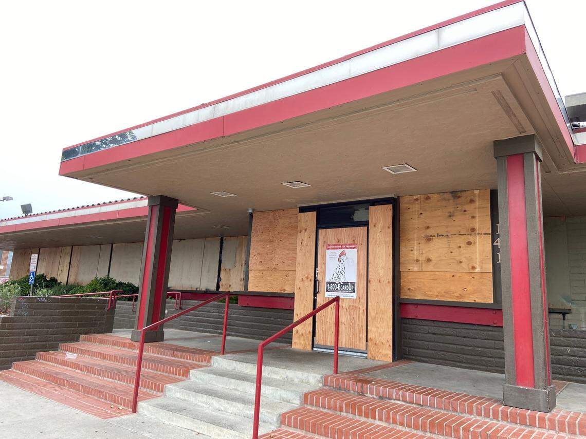 The main entrance to the downtown Fresno Denny’s is boarded up after a Nov. 22 fire.