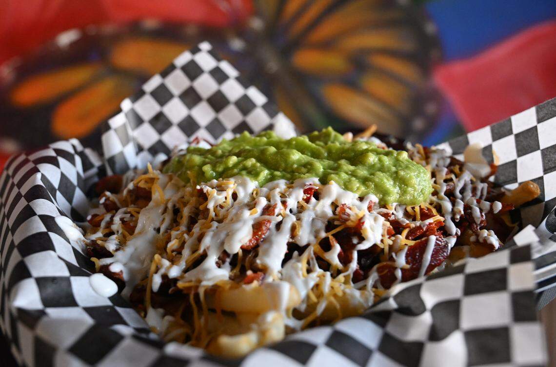 Adobada Fries topped with sour cream and guacamole is seen at the new Frida’s Azul, offering Mexican food as well as breakfast items like eggs and chilaquiles plus espresso drinks and agua frescas at its Herndon and Willow avenues location in Clovis. Photographed Thursday, July 24, 2025.