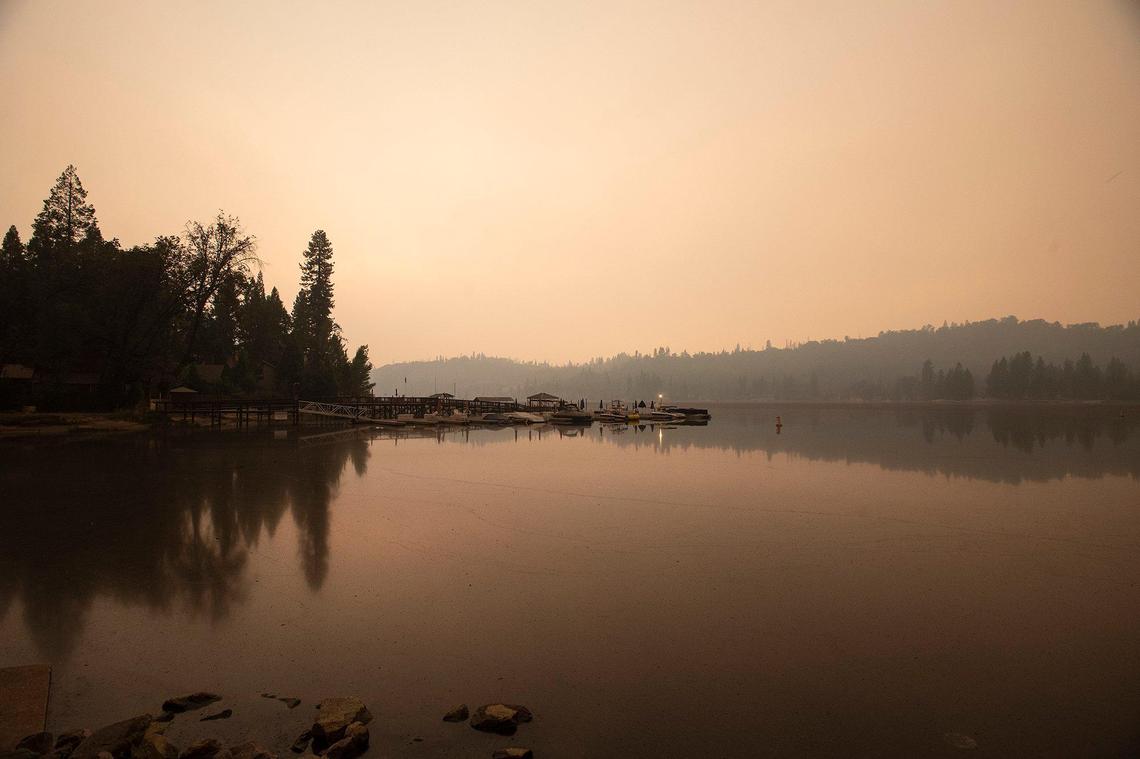 Smoke from the nearby Creek Fire fills the air over Bass Lake in Bass Lake, Calif, on Sunday, Sept. 6, 2020.