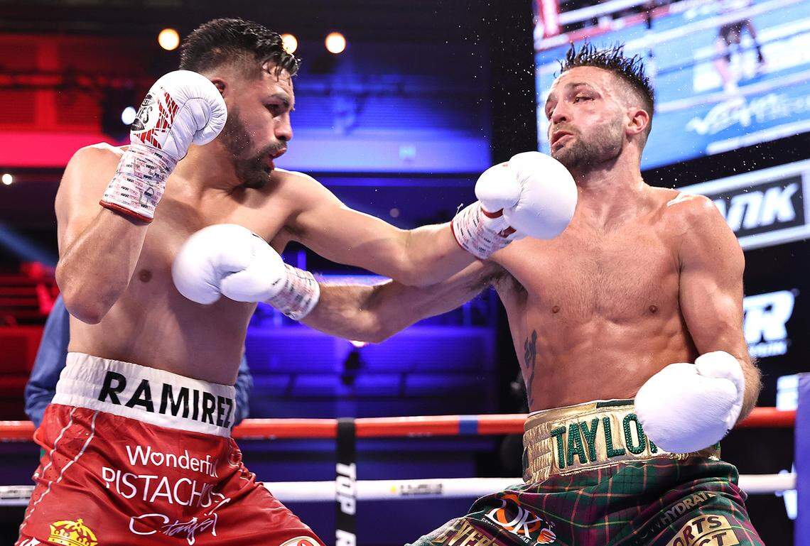 Jose Ramirez, left, and Josh Taylor exchange punches during their fight for the undisputed junior welterweight championship at Virgin Hotels Las Vegas on May 22, 2021, in Las Vegas, Nevada.