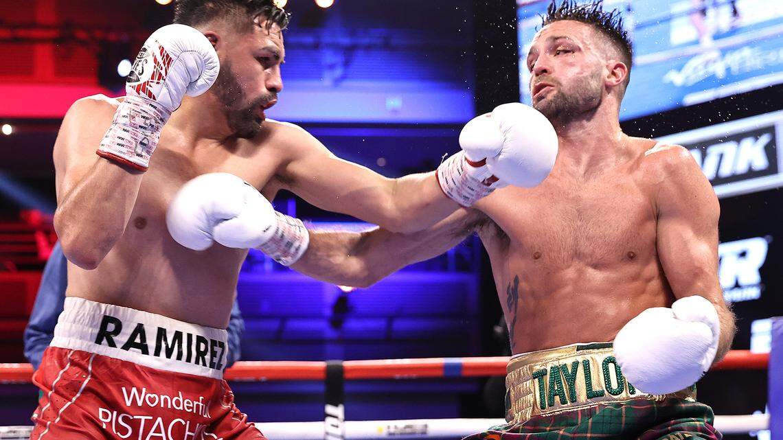 Jose Ramirez, left, and Josh Taylor exchange punches during their fight for the undisputed junior welterweight championship at Virgin Hotels Las Vegas on May 22, 2021 in Las Vegas, Nevada.
