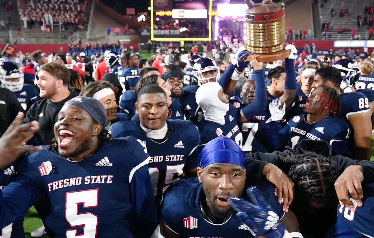 The Fresno State football team celebrates its 32-28 win over San Diego State, pulling ahead in the final minutes to win the Battle For The Old Oil Can Saturday, Oct. 29, 2022 in Fresno.
