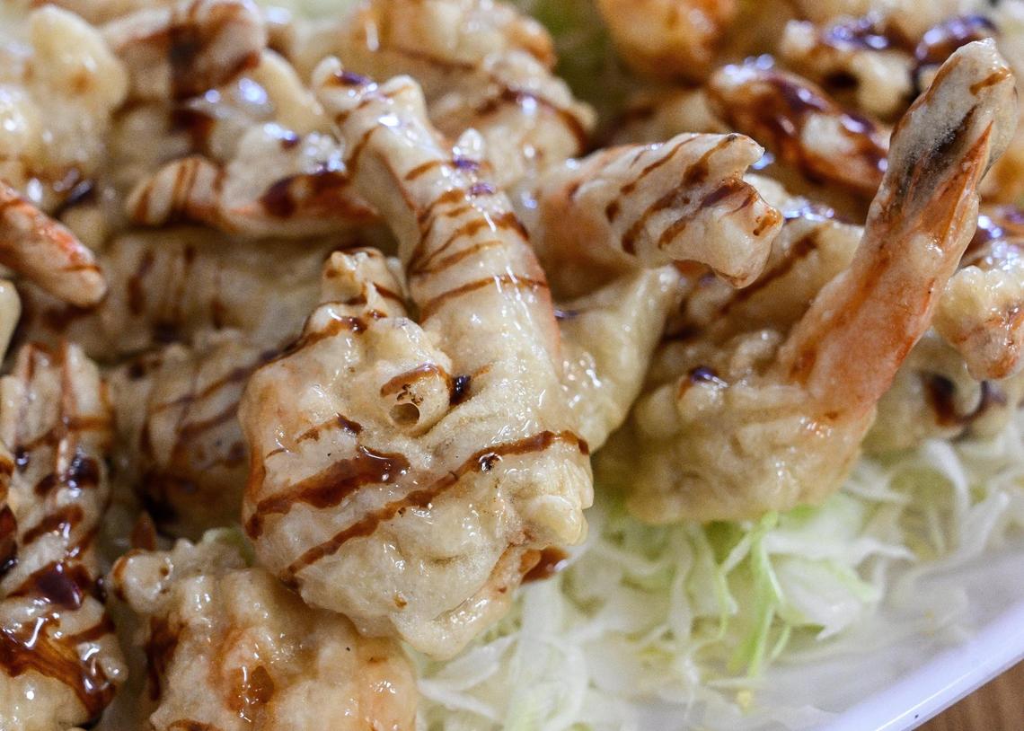 Cream shrimp is shrimp with a tempura-like coating, cream sauce and a drizzle of balsamic sauce and peanuts on top from Paik’s Noodle in north Fresno.