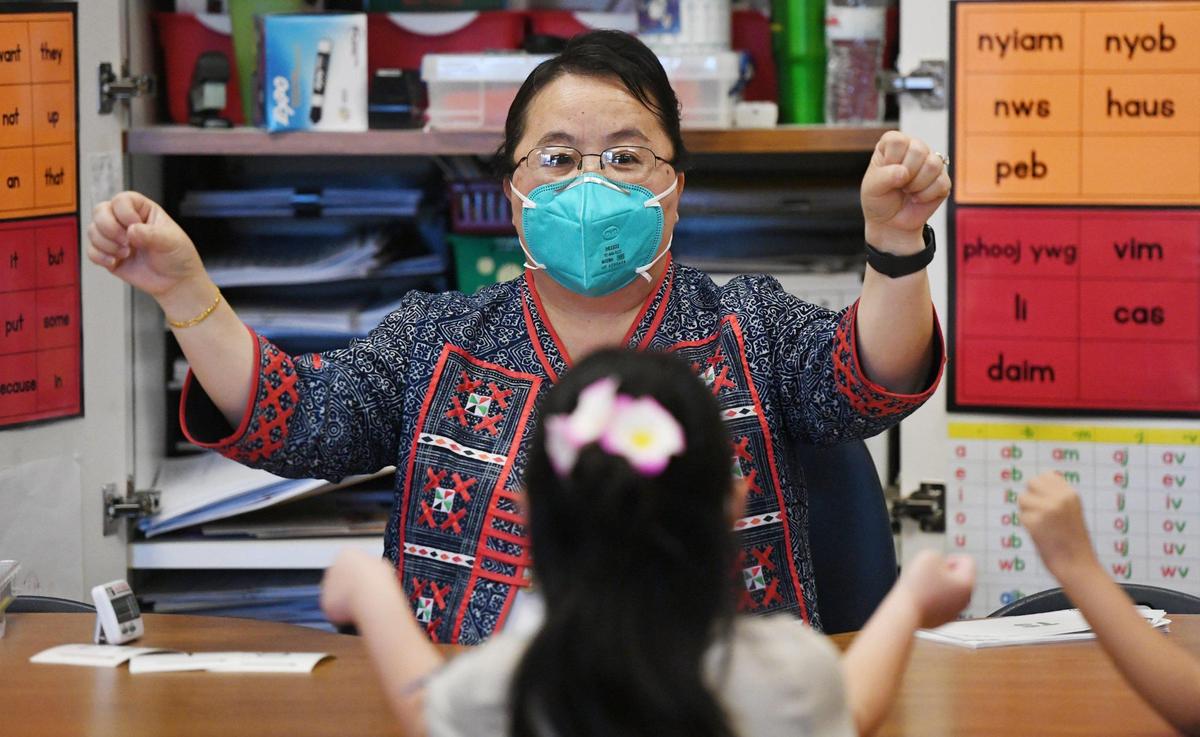 Kindergarten teacher May Yang leads a lesson in Fresno Unified’s Hmong Dual Immersion program at Vang Pao Elementary Thursday, Feb. 23, 2023 in Fresno.