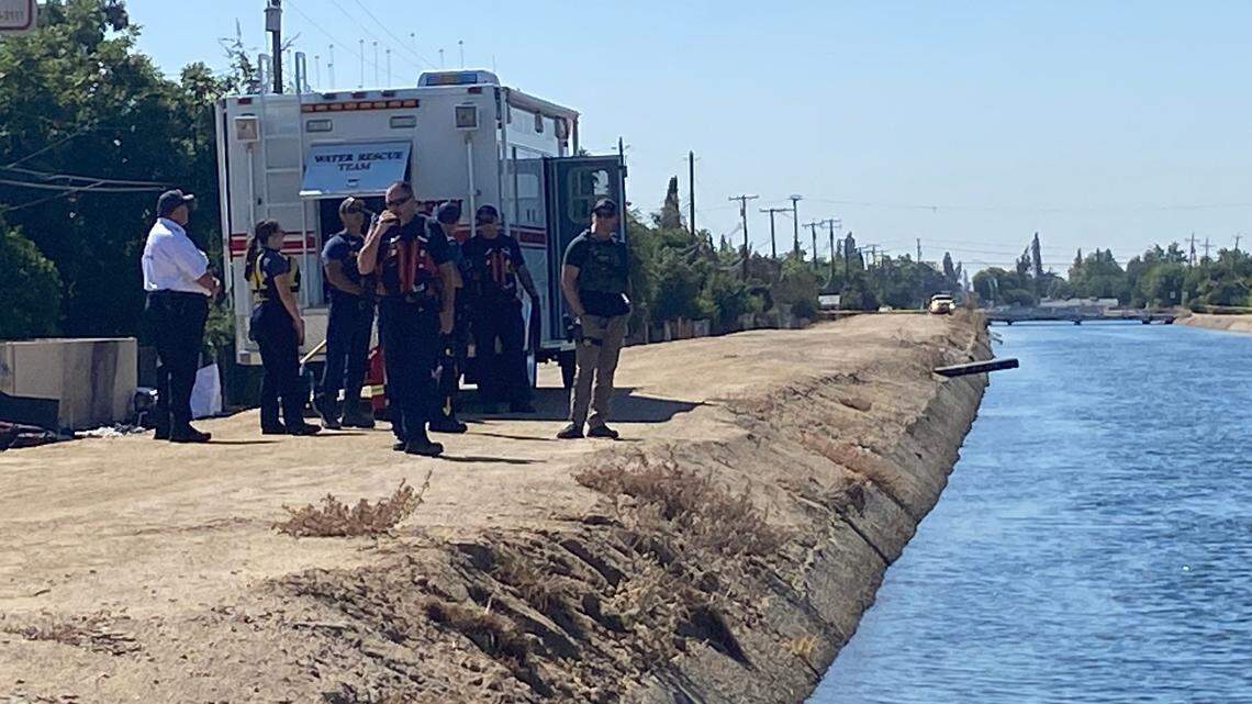 First responders study a canal where a body was reported about 11 a.m. Tuesday, Sept. 12, 2023, in Fresno.