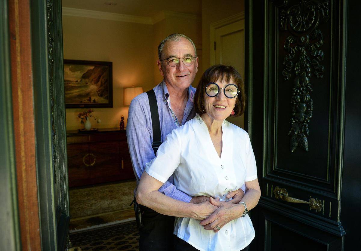 Erna Kubin-Clanin, the former owner of Erna's Elderberry House, and her husband René Clanin stand in the doorway of the French chateau they built near Oakhurst in 1993. The couple will sell the 4522-square-foot home nestled at the top of nearly six acres for $1.25 million and move to her native Austria.