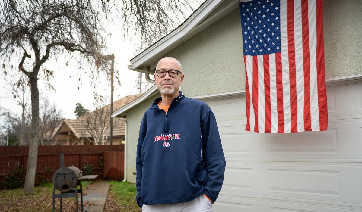 Chris DeLeon, an IRS worker who has had his cancer treatments disrupted due to the government shutdown, stands outside his Old Town Clovis home on Tuesday, Jan. 15, 2019.