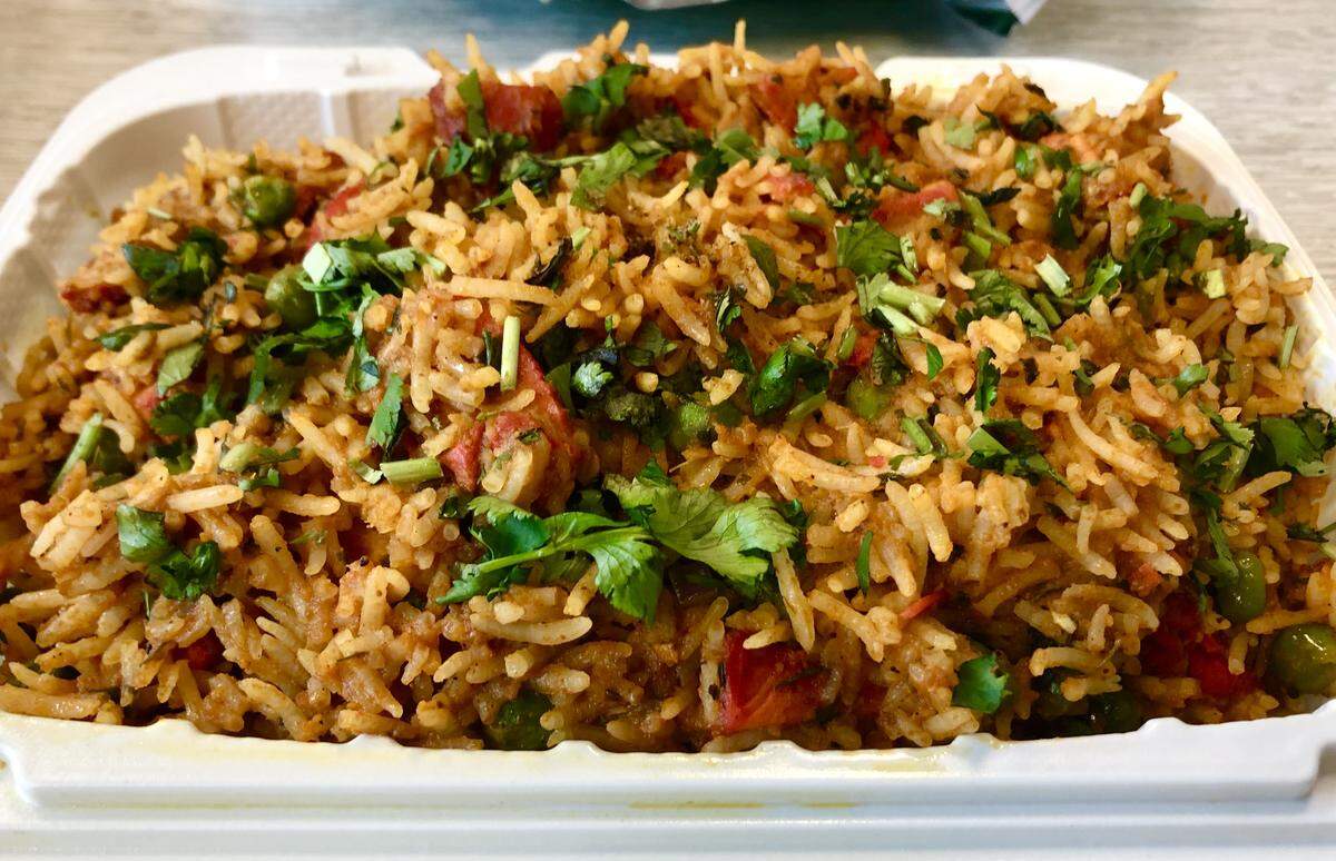 Punjabi Naan, a restaurant inside the gas station Loma Vista Market, has received praised for its Indian food. Among the dishes it serves is biryani rice with chicken.
