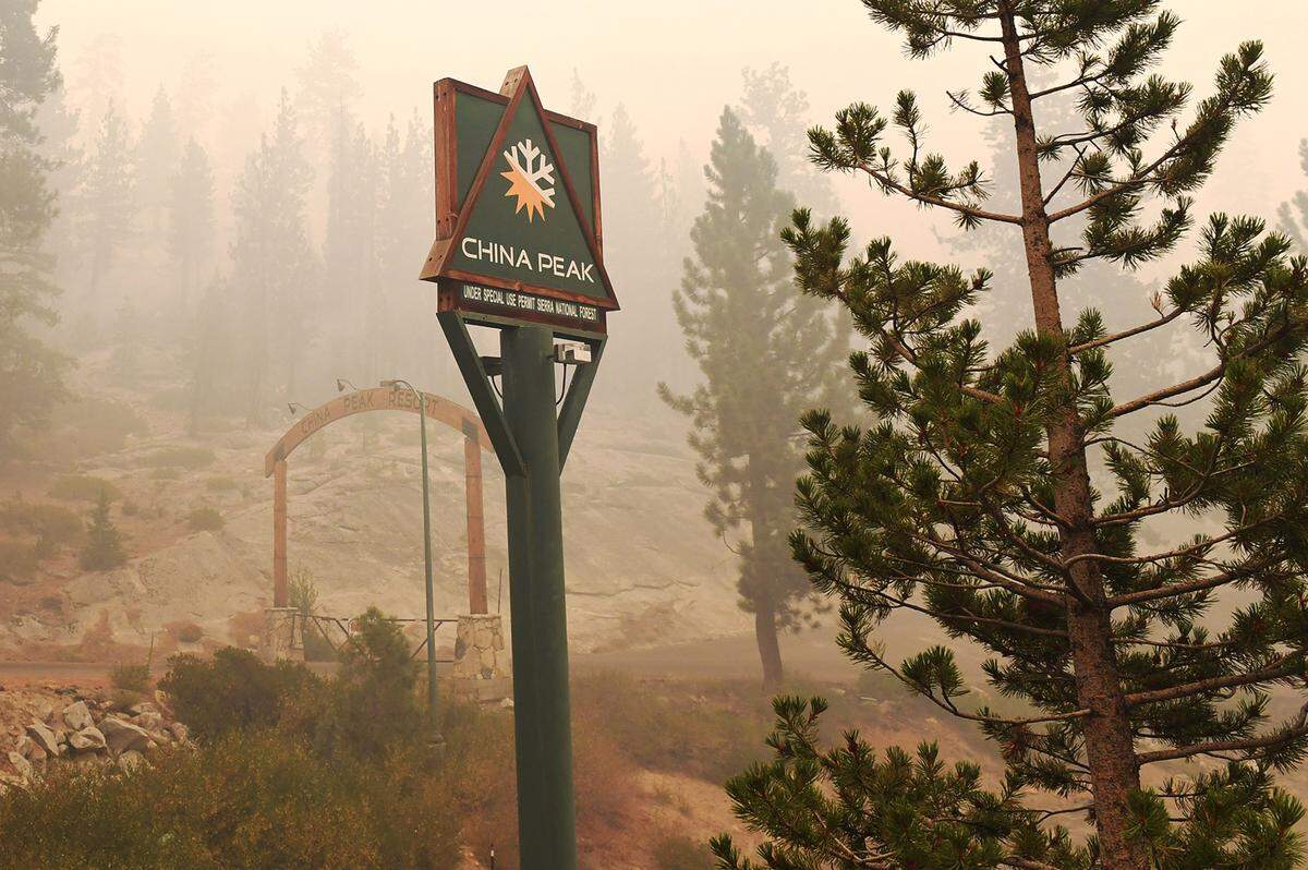 Heavy smoke shrouds the entrance to entrance to China Peak Mountain Resort along Highway 168 Wednesday, Sept. 9, 2020.