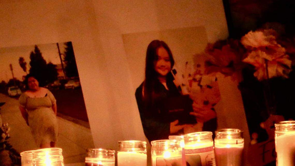 Candles were placed in front of a photo of Mang and Eliza Yang, both killed when a gang member crashed his vehicle into the bedroom following a pursuit on Wednesday, Oct. 16, 2024.