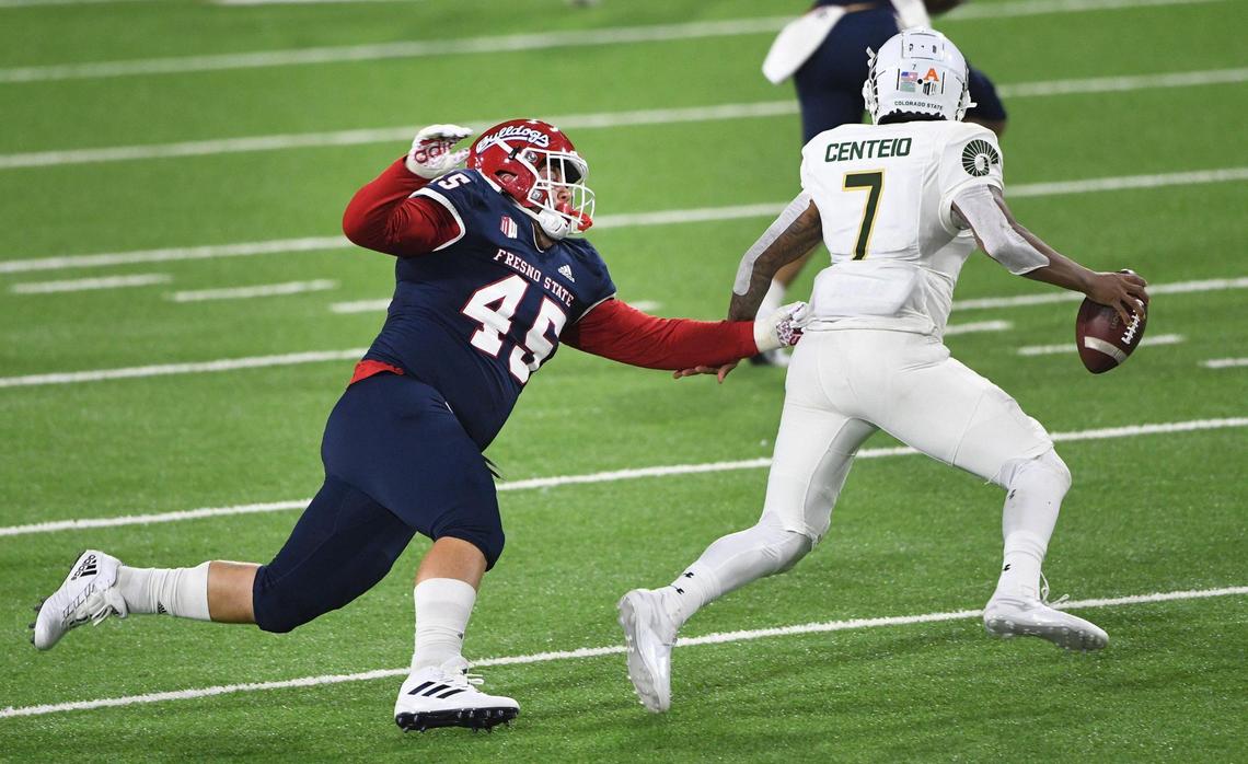 Fresno State defensive tackle Kurtis Brown chases down Colorado State quarterback Todd Centeio during their game at Bulldog Stadium on Thursday, Oct. 29, 2020.