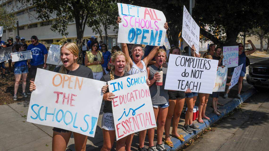 Immanuel schools students joined hundreds of supporters by holding signs and cheering outside B.F. Sisk courthouse in support of the schools’ decision to defy the county’s COVID-19 orders by opening its doors to in-person education, prior to a court hearing to decide if it can continue such instruction, on Tuesday, Aug. 25, 2020.