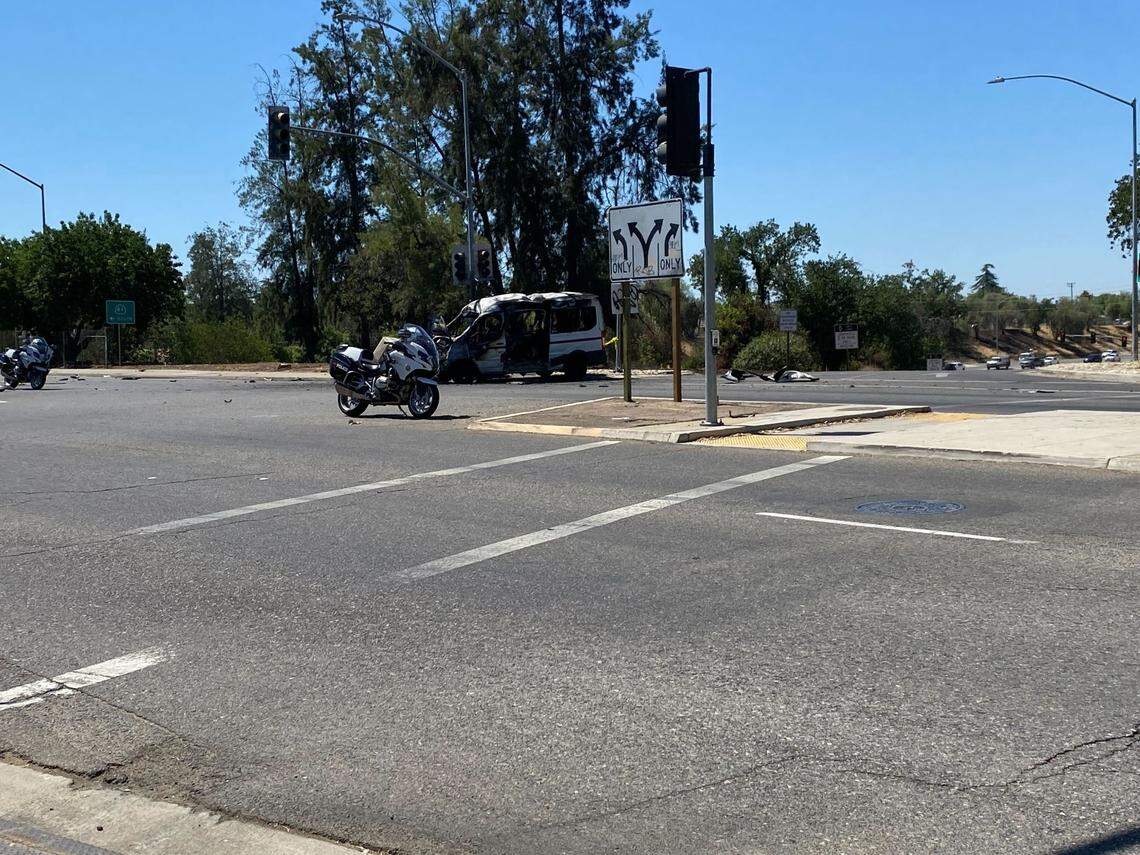 Police mark off a collision scene after two cars were involved in a reported hit-and-run at Ashlan Avenue and Highway 41 in Fresno, California on Friday, June 24, 2022.