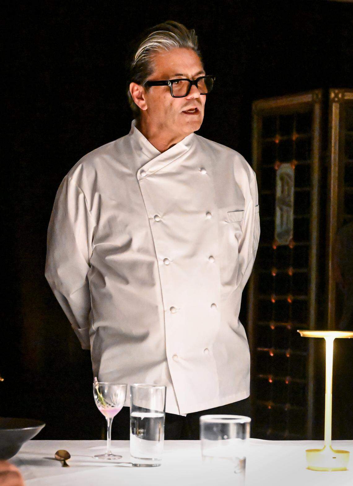 Head chef Charles Armenta talks to guests during a media event to promote The PM Lounge, a new members-only club that promises to provide high-level dining and live music for guests.