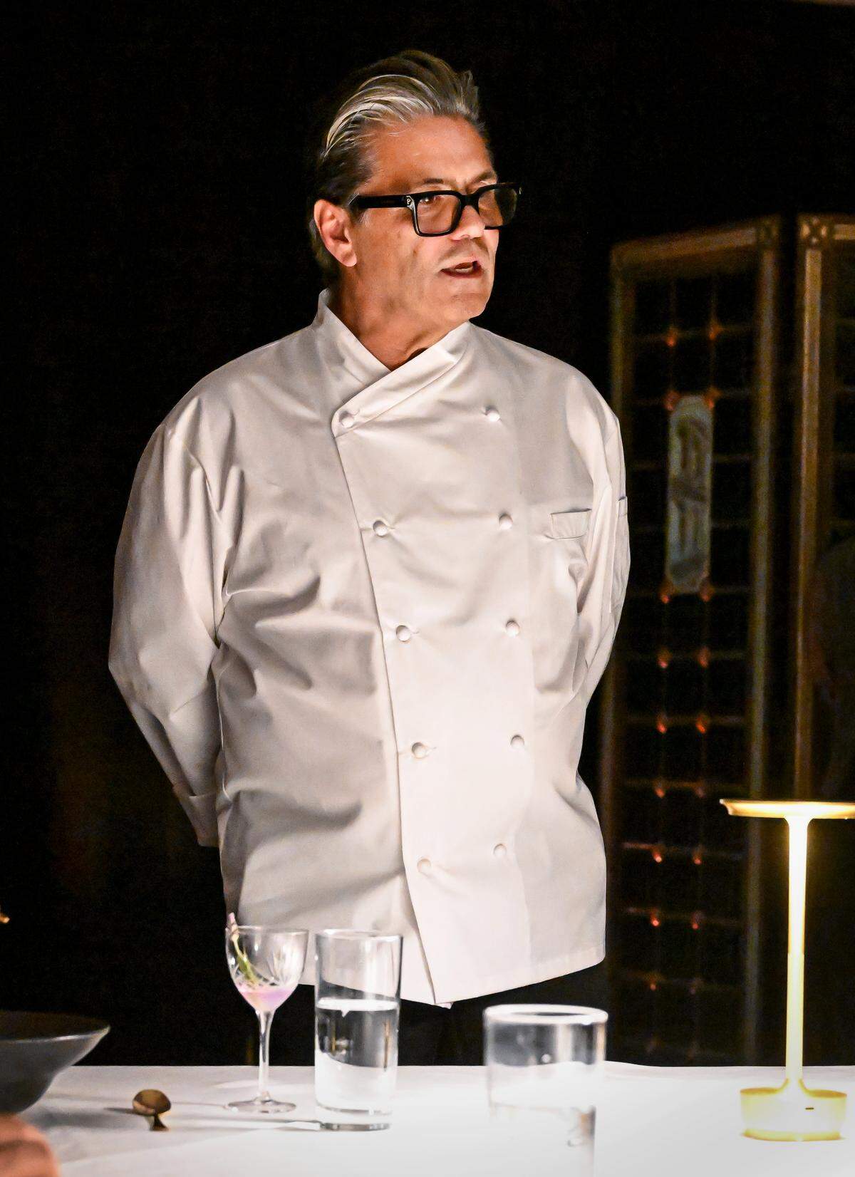 Head chef Charles Armenta talks to guests during a media event to promote The PM Lounge, a new members-only club that promises to provide high-level dining and live music for guests.
