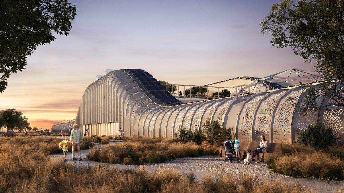 El exterior de una futura estación del tren de alta velocidad en el Valle Central se muestra en esta representación artística con zonas para pasear y sentarse en medio de un paisaje de pradera.