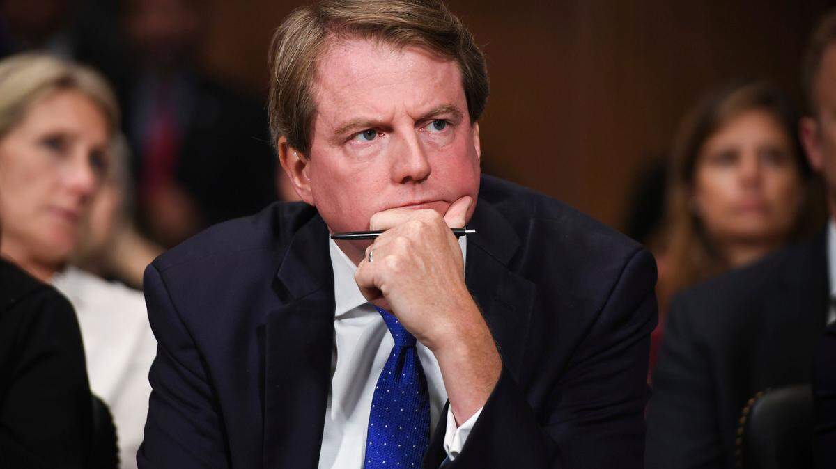 In this Sept. 27, 2018, photo, then-White House counsel Don McGahn listens as Supreme court nominee Brett Kavanaugh testifies before the Senate Judiciary Committee on Capitol Hill in Washington. The federal appeals court in Washington, is giving the House another shot at forcing McGahn to appear before Congress. Nine of the Democratic-dominated court’s 11 judges heard arguments by telephone Tuesday, April 28, 2020, in a dispute between House Democrats and President Donald Trump’s administration over a subpoena for McGahn’s testimony that was issued a year ago by a House committee.